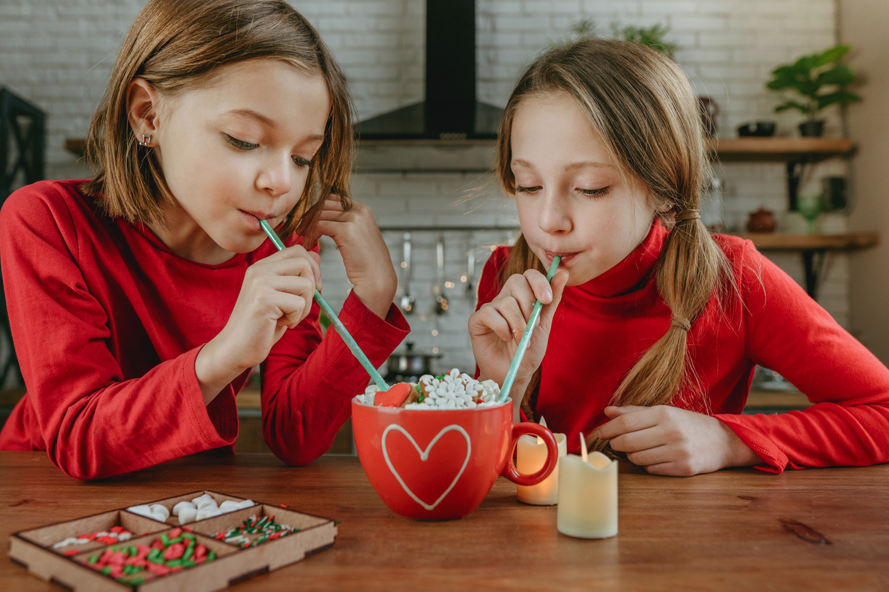 Two Young Girls Learning How to Make Hot Chocolate for Kids